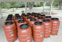Bringing Conservation to the Community Fig. 1: Fifty-five-gallon rain barrels were provided free of charge to 115 workshop attendees. Photo credit: AU-SRF