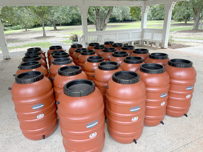Fig. 1: Fifty-five-gallon rain barrels were provided free of charge to 115 workshop attendees. Photo credit: AU-SRF